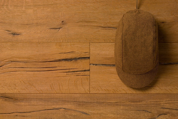 Velo/City Cap - Wool Herringbone #02 3-panel cap lying on a table.  Overhead view.